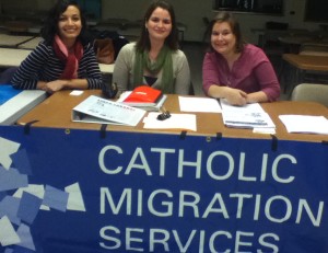 Megan Helbling, Kimberly Kearns, and Rebecca Rybaltowski at the Catholic Migration Services information table
