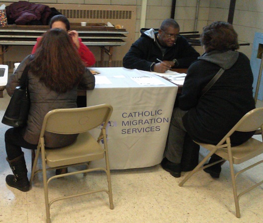 QCUA volunteers conduct basic intake with attendees