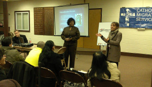 Shyconia discusses the citizenship application process as NALEO's Ana Almanazar translate for Spanish-speaking attendees