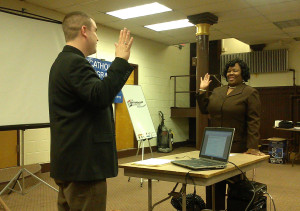 USCIS Community Relations Officer Shyconia Burden and Immigration Officer Stephen Wittreich conduct a mock citizenship interview