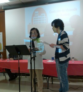 Corona resident Grace (left) addresses the press and QHC through a Korean interpreter