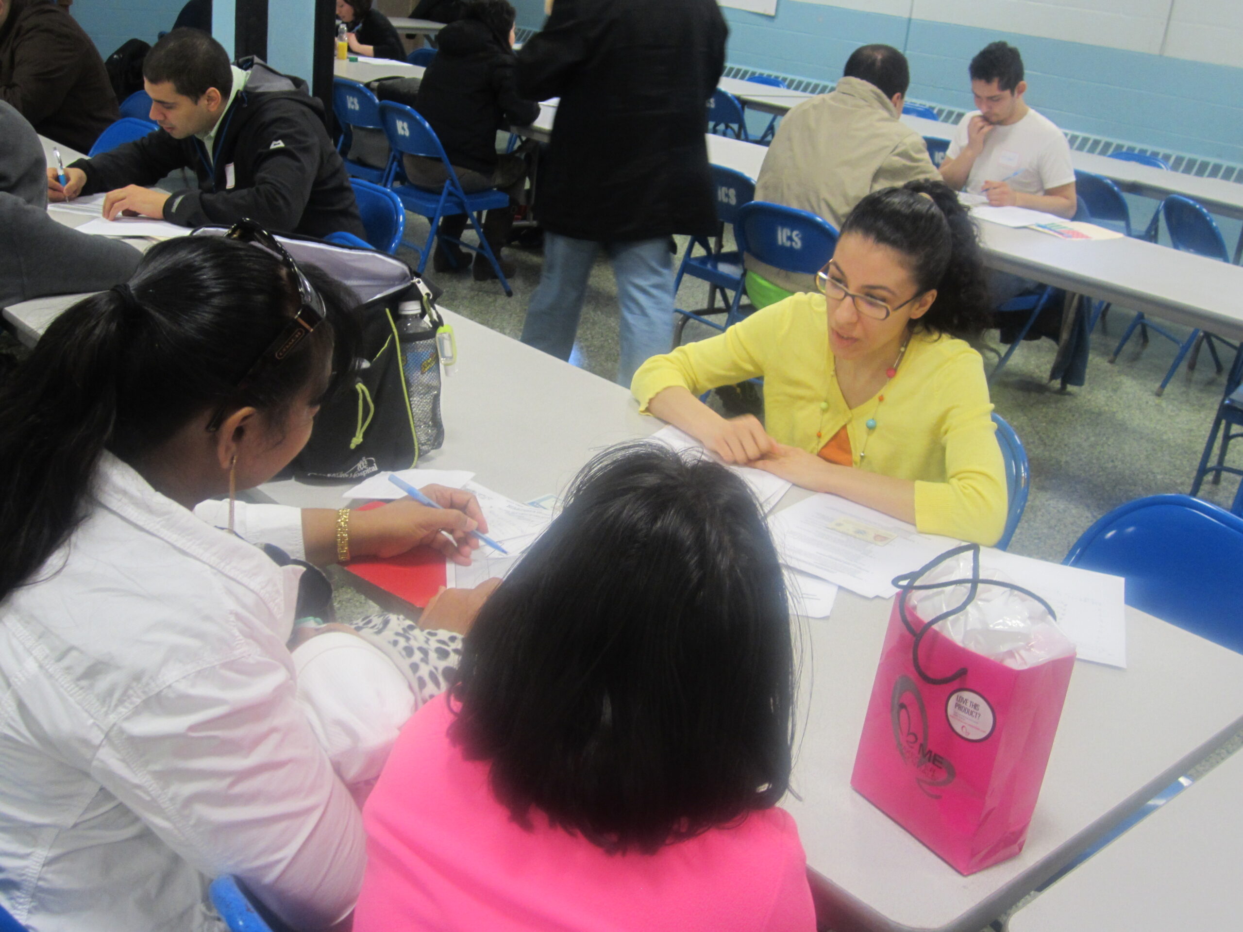 Two women and a girl filing applications