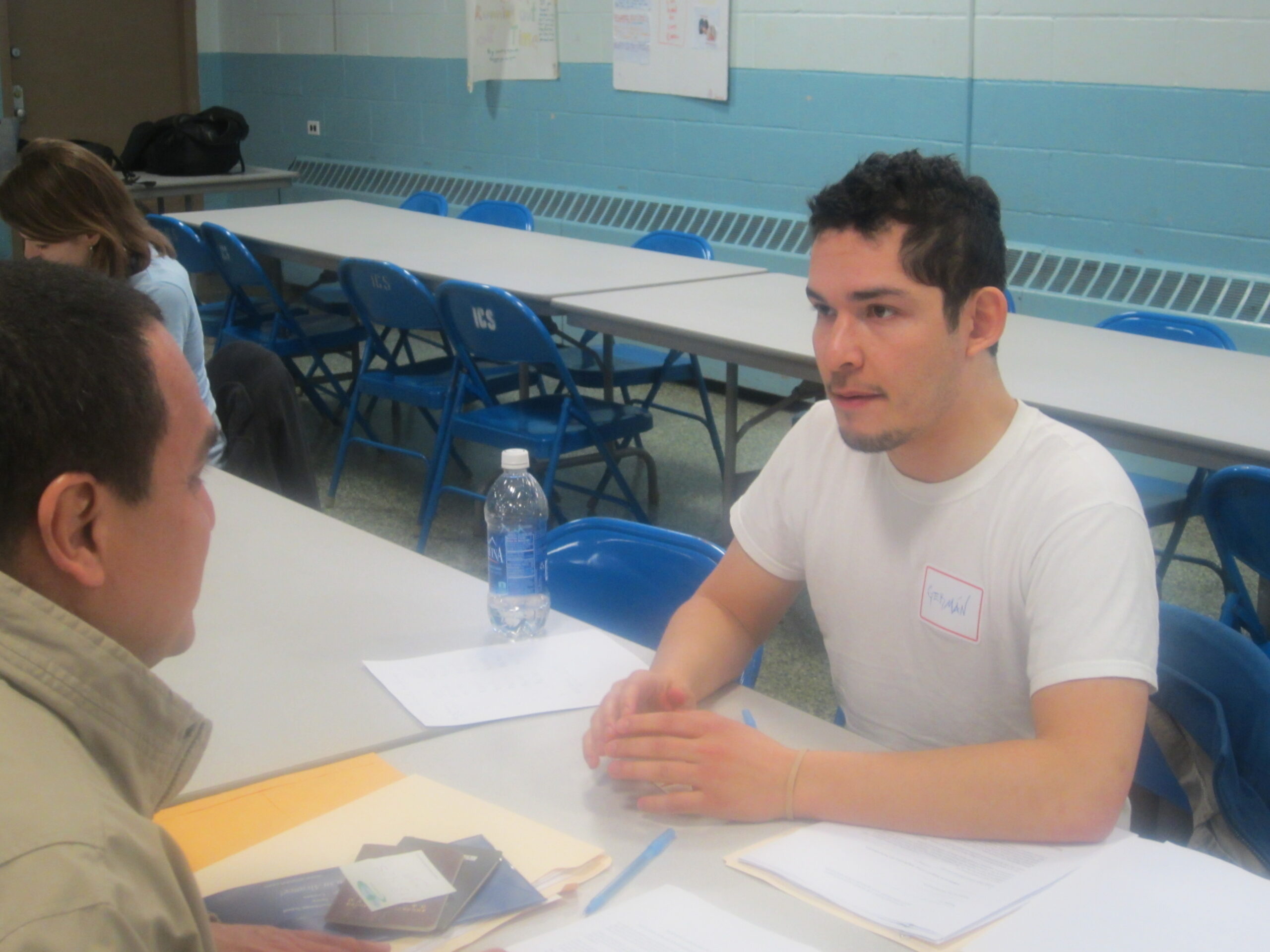 Two men conversating across a table