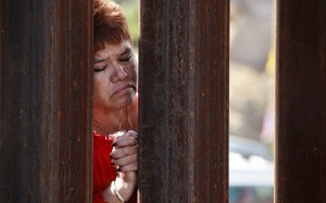 A woman behind the border sad