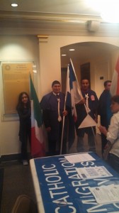 Two Man and a girl holding flags
