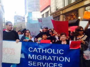 Group of people marching with CMS