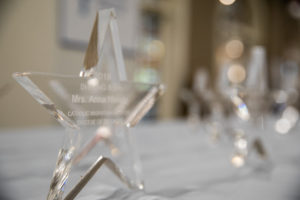 A Star Shaped Award with Writing embedded in it